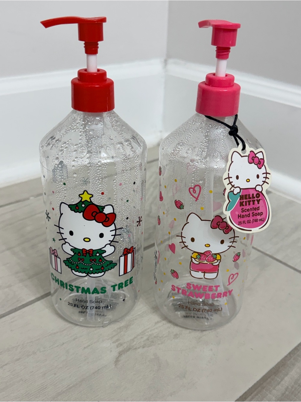 Hello Kitty Sweet Strawberry and ChristmClear Hand Soap Bottles (two) plastic